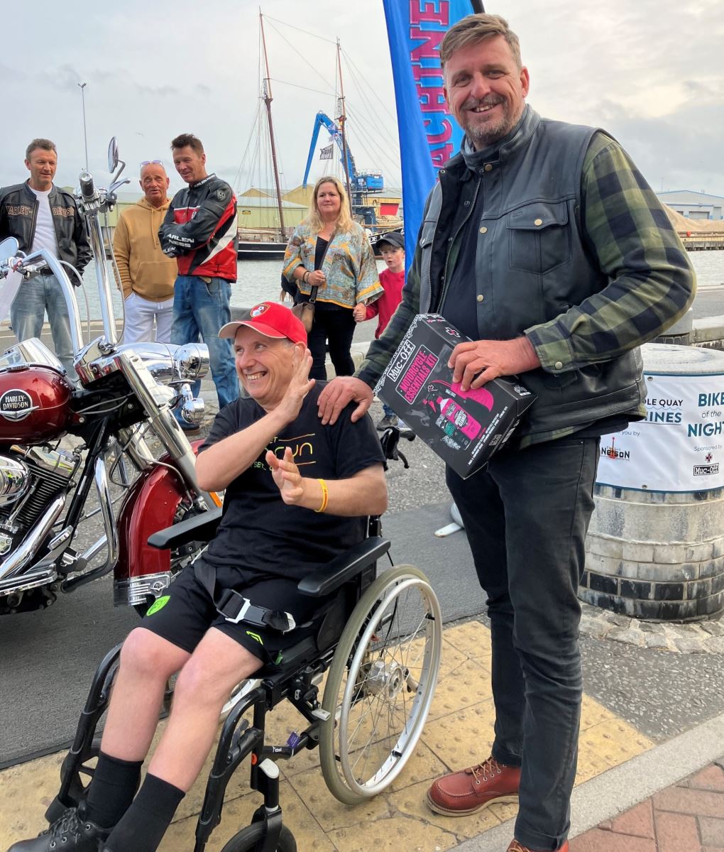 Man acceptin award for best bike at Poole Quay bike night event